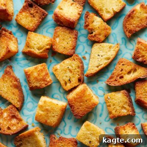 Perfectly Crispy Air Fryer Croutons 7 Crispy Air Fryer Croutons served in a white bowl.