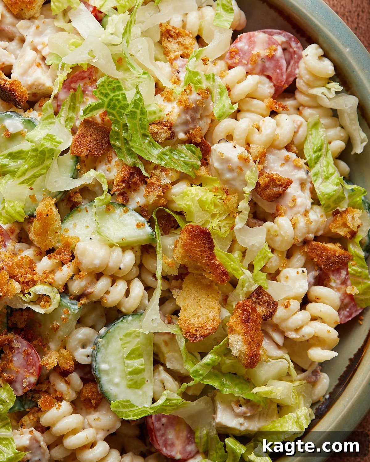 Up close overhead image of chicken caesar pasta salad. 