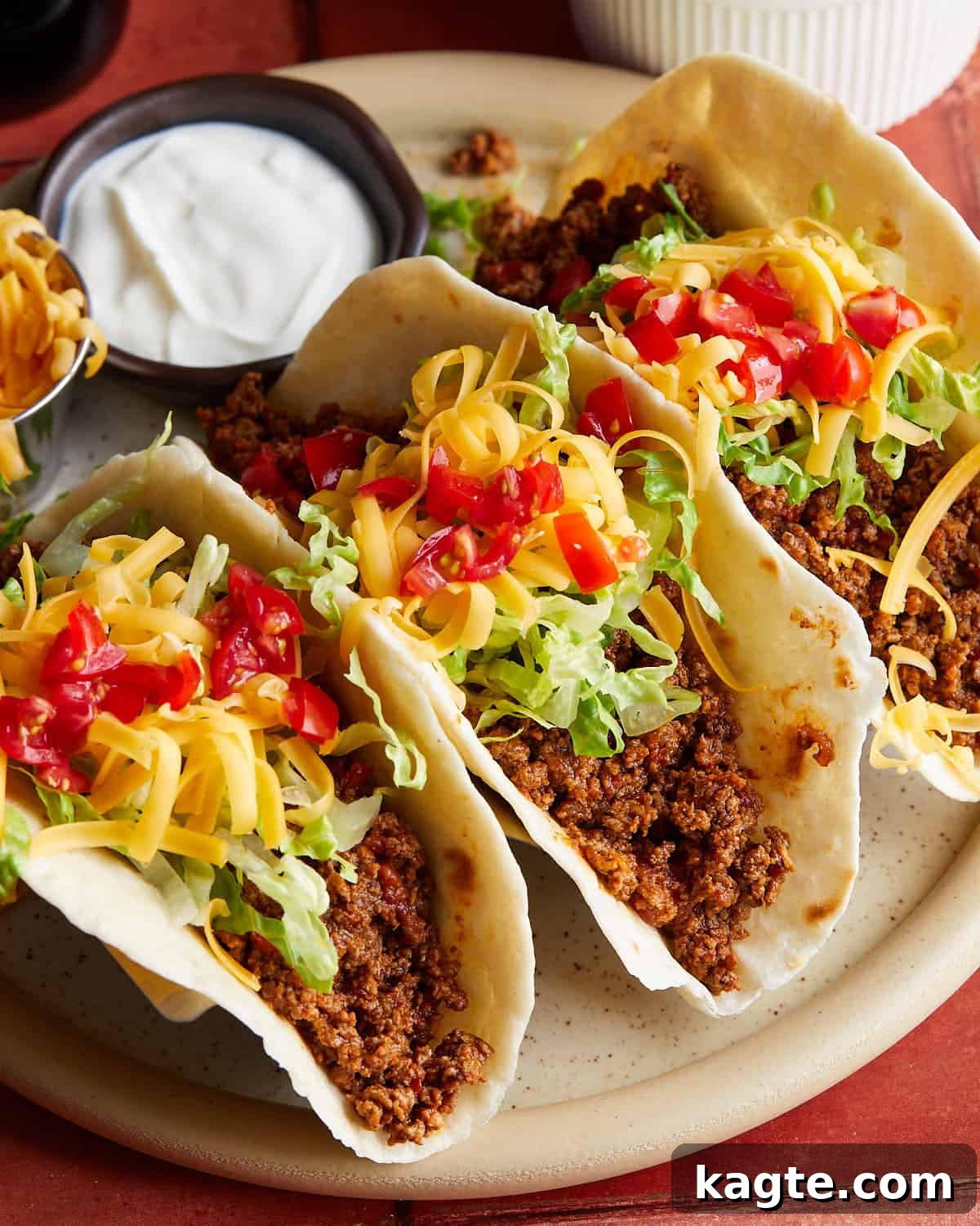 Up close image of beef soft tacos with garnish.