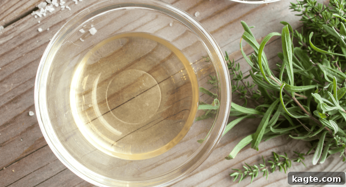 Clever Replacements for Rice Vinegar 3 Overhead image of white wine vinegar in a bottle and a small bowl.