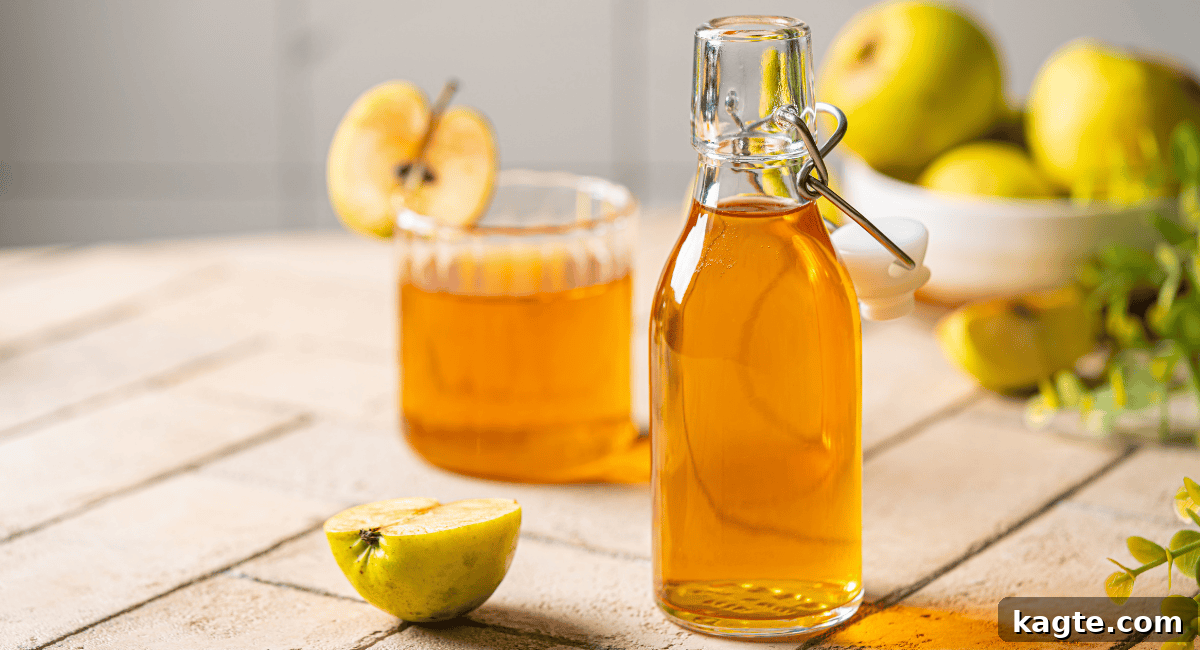 Clever Replacements for Rice Vinegar 4 Up close image of apple cider vinegar in a glass bottle and a measuring cup.