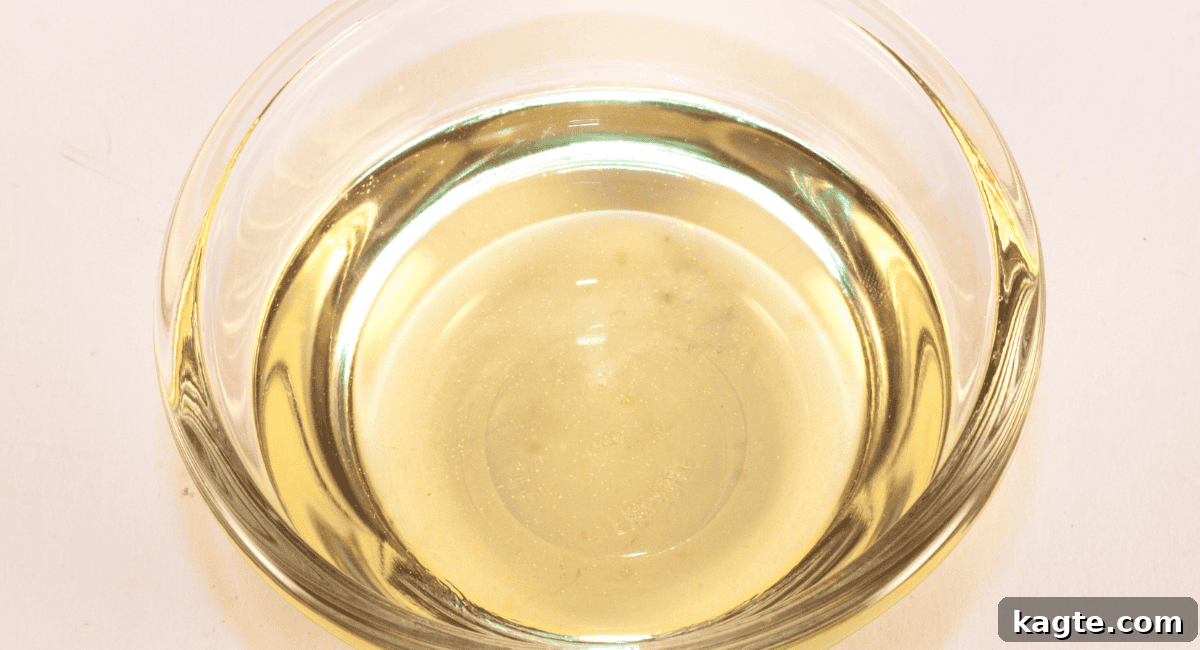 Clever Replacements for Rice Vinegar 5 Overhead up close image of champagne vinegar in a clear bottle.