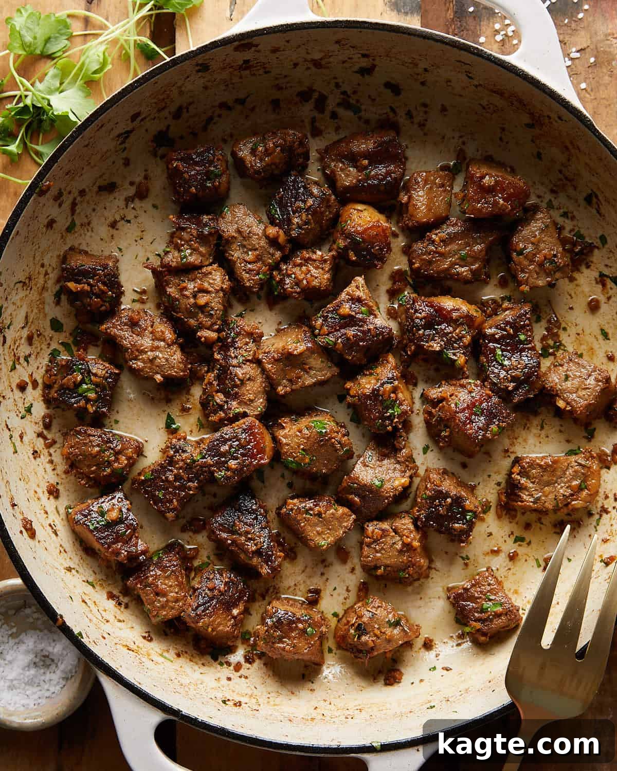 Succulent Garlic Butter Steak Bites 2 Overhead image of garlic butter steak bites with garnish.