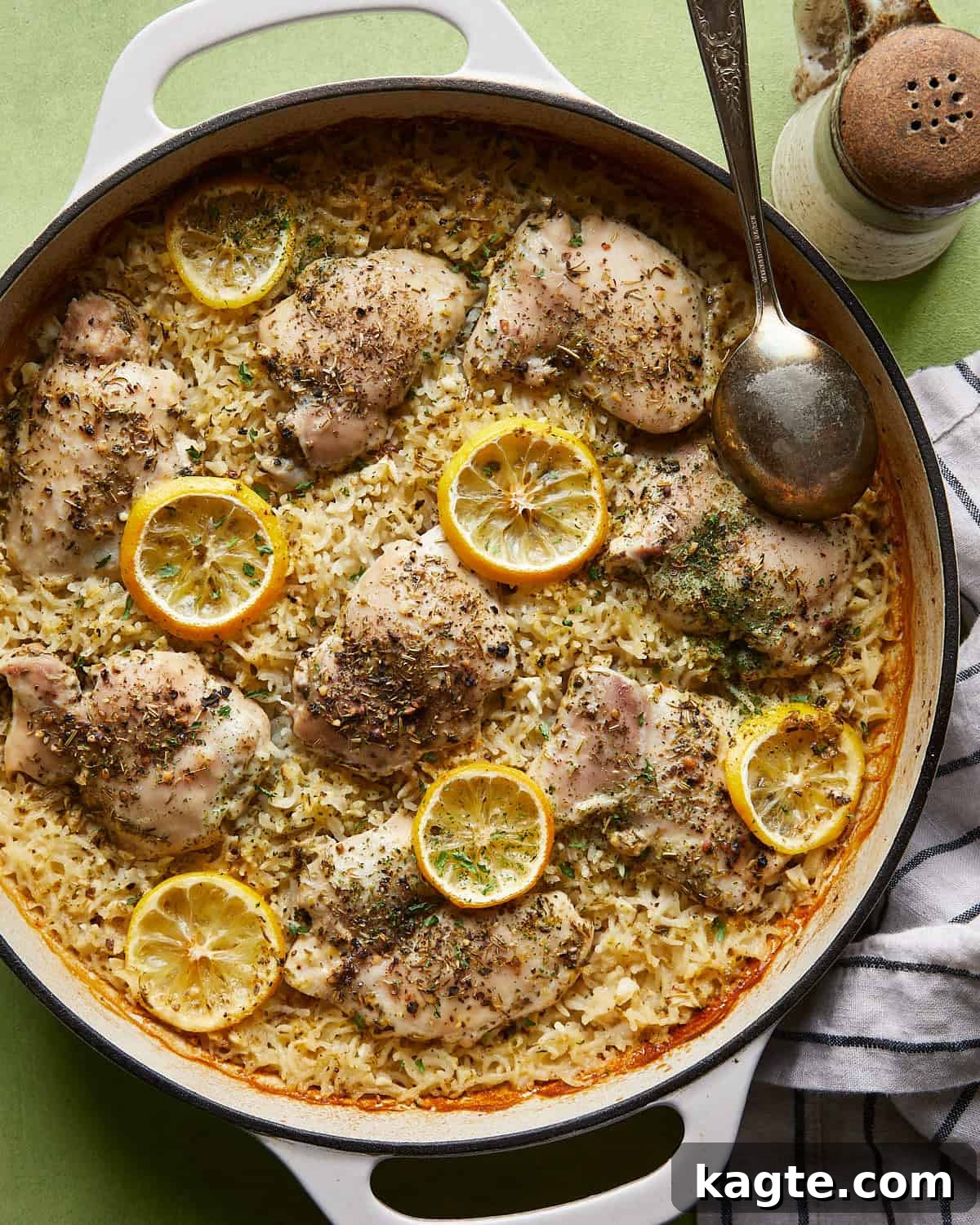 Zesty Lemon Chicken and Rice Bake 2 Overhead image of baked lemon chicken and rice recipe in white pan.