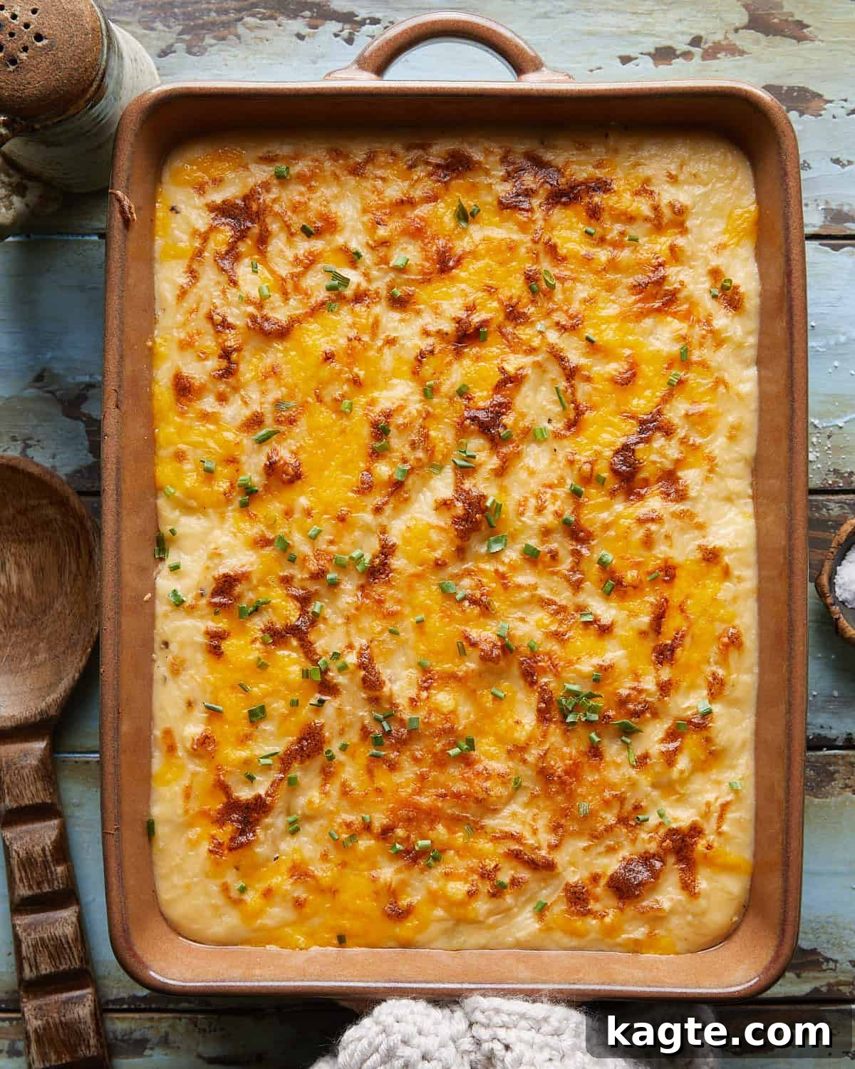 Effortless Gooey Cheesy Potatoes 2 Overhead image of cheesy mashed potatoes with garnish.