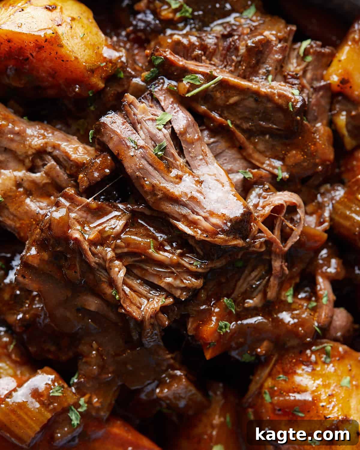 Close-up overhead view of shredded beef from Dutch Oven Pot Roast.