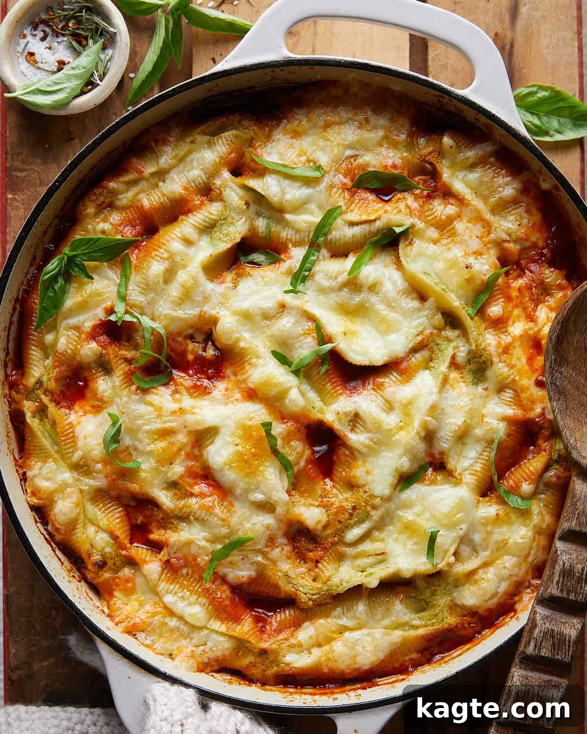 Cheesy baked stuffed shells in white casserole dish, homemade stuffed shells with ricotta and mozzarella, family-friendly dinner idea. 