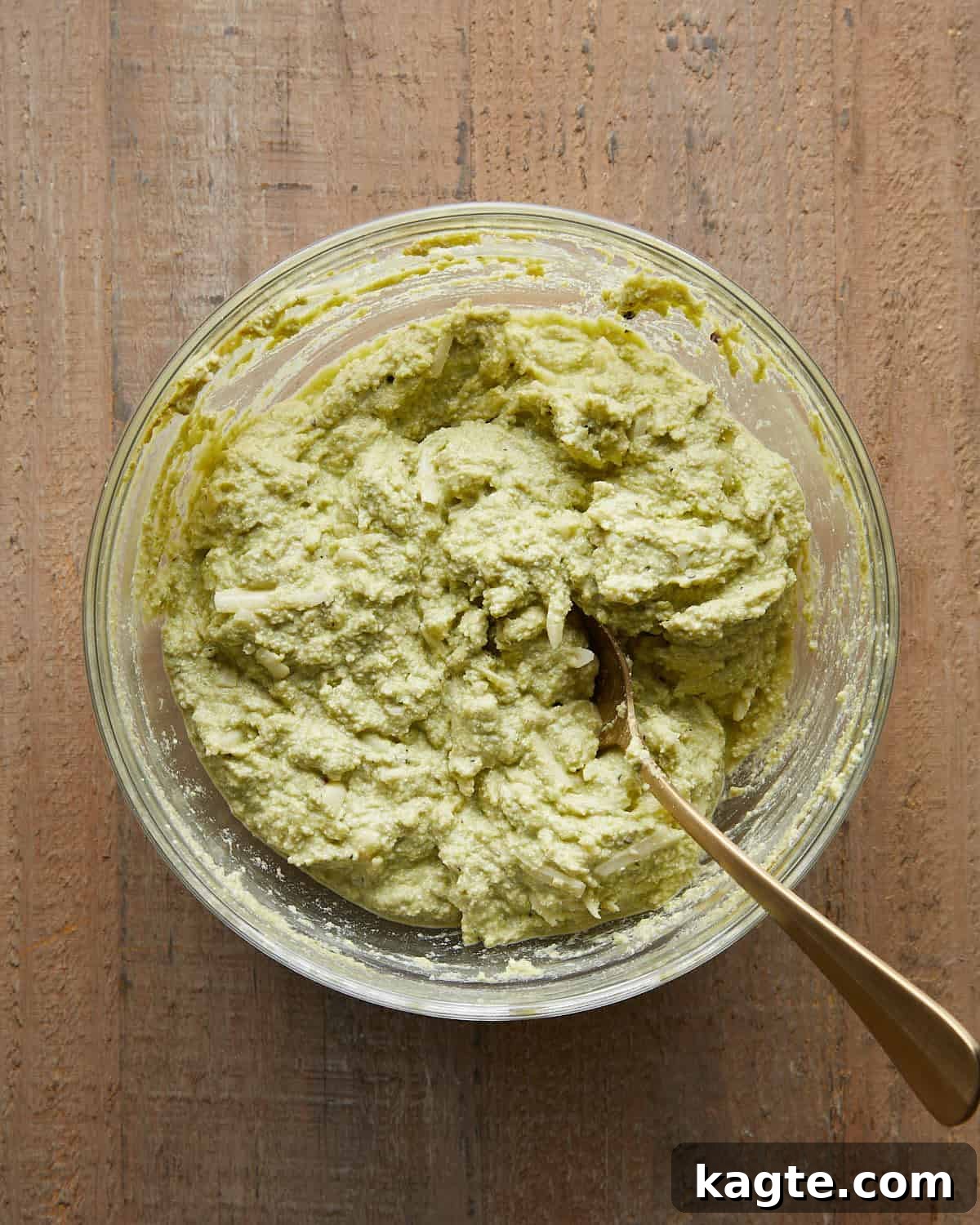 Ricotta and pesto mixture prepared to stuff shells for baked stuffed shells recipe.