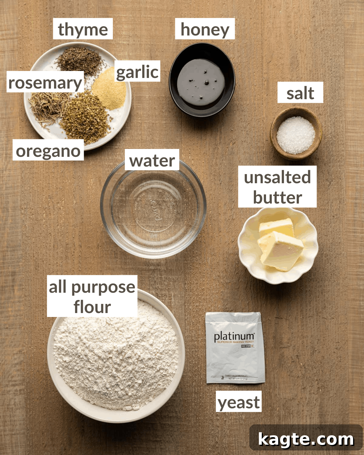 Cheesy Garlic Herb Swirl Rolls 3 Collection of dough ingredients including water, honey, yeast, butter, oregano, thyme, rosemary, garlic powder, bread flour, and salt.