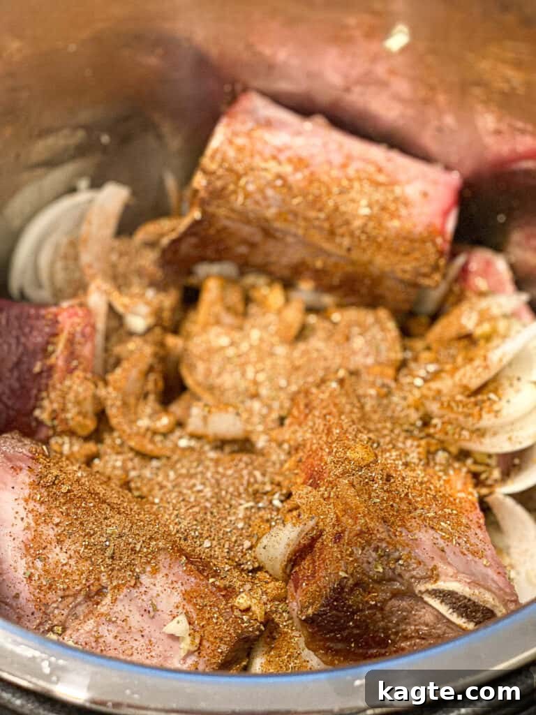 Fall-Apart Tender Instant Pot Barbacoa Tacos 4 All the spices and aromatics laid out on a cutting board.