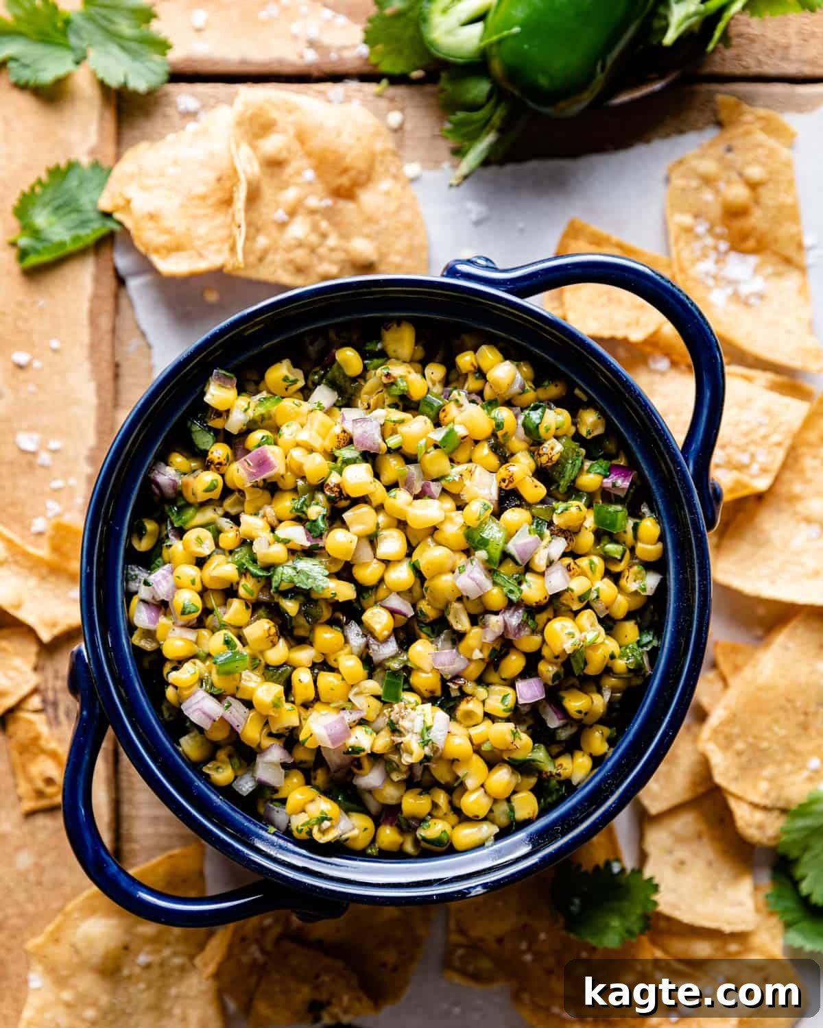 Smoky Sweet Corn & Chili Medley 2 overhead shot of roasted chili corn salsa in a bowl with tortilla chips