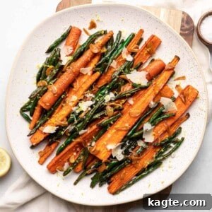 Golden Roasted Green Beans and Carrots 7 Roasted Green Beans and Carrots on a white plate