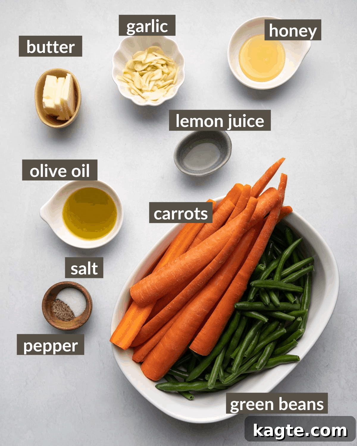 Golden Roasted Green Beans and Carrots 3 Overhead shot of fresh carrots, green beans, olive oil, honey, salt, pepper, butter, garlic, lemon, and parmesan cheese for roasted vegetables.