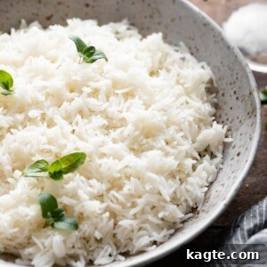 Perfect Instant Pot Basmati Rice 7 Fluffy Instant Pot Basmati Rice in a serving bowl with a spoon.