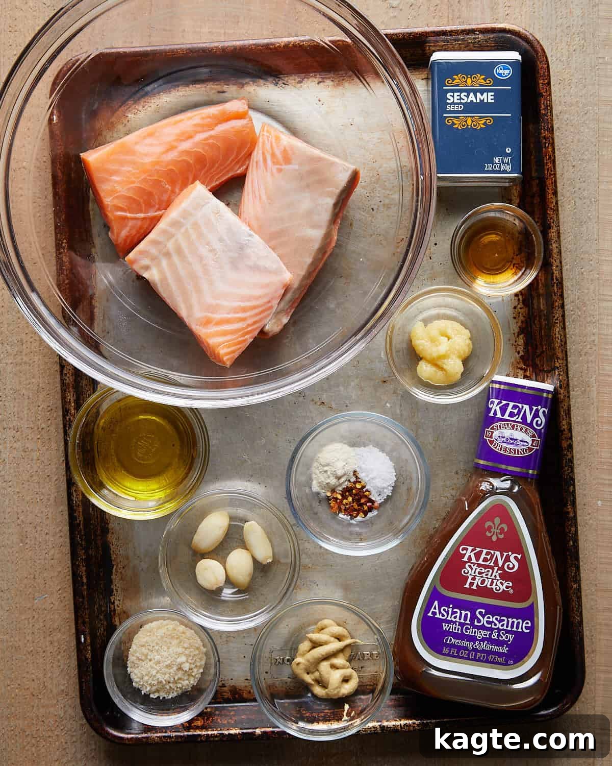 Flavor-Packed Salmon Burgers with Zesty Sriracha Aioli 3 Overhead shot of ingredients for Asian salmon burgers, including fresh salmon, green onions, garlic, ginger, soy sauce, sesame oil, breadcrumbs, and eggs.