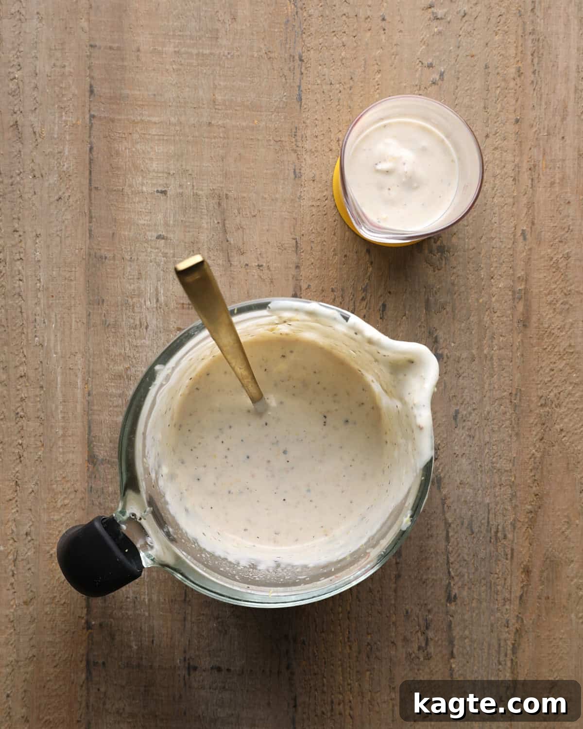 Grilled Chicken Marinated in Caesar Dressing 4 Caesar marinade ingredients mixed in a small bowl with a spoon.