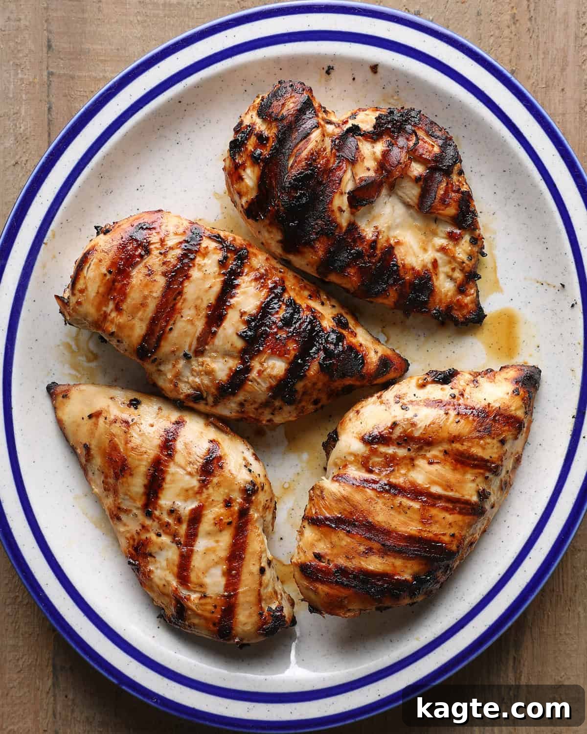 Grilled Chicken Marinated in Caesar Dressing 6 Grilled Caesar chicken breasts on a serving plate.