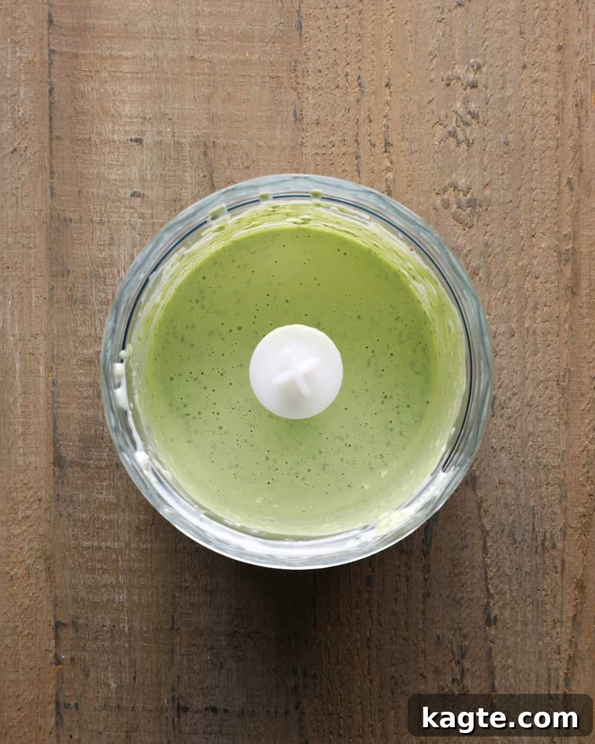 Creamy Homemade Basil Aioli 4 Creamy basil aioli in a food processor after blending.