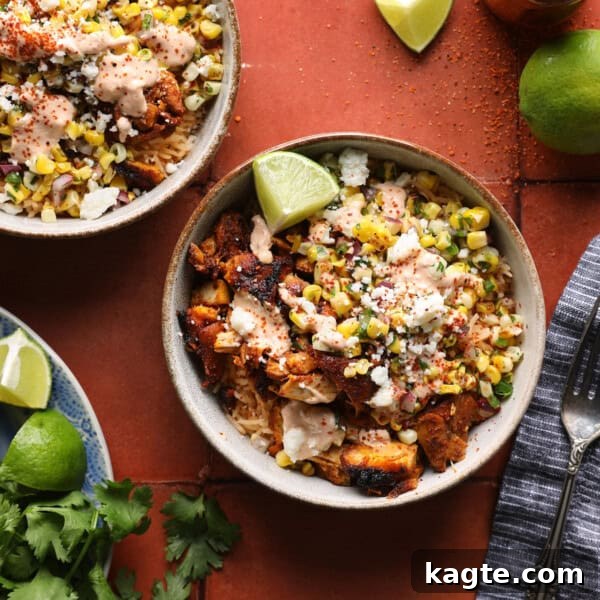 Slow Cooker Greek Lemon Chicken and Potatoes 14 Street corn chicken rice bowl with grilled chicken, corn salsa, crema, Cotija cheese, and lime wedges.