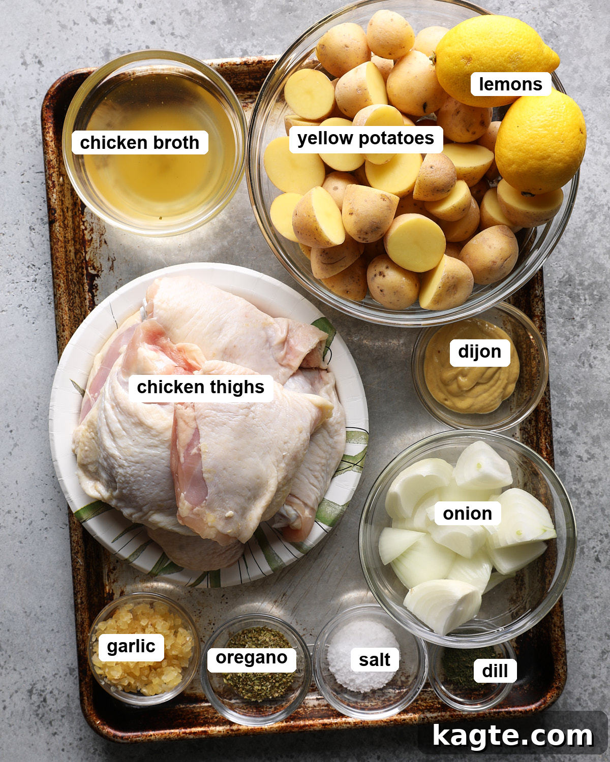 Slow Cooker Greek Lemon Chicken and Potatoes 3 Labeled ingredients for slow cooker Greek lemon chicken and potatoes arranged on a table.