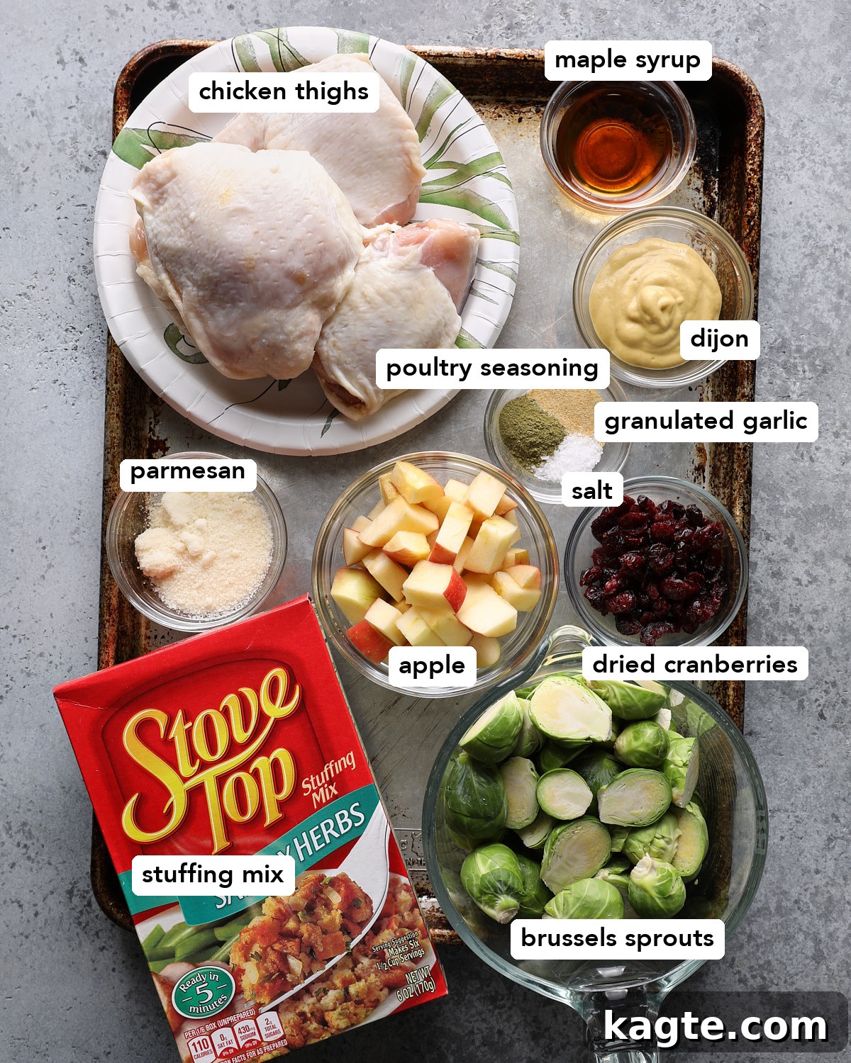Sheet Pan Roasted Chicken with Herb Stuffing 3 Chicken thighs, stuffing mix, Brussels sprouts, apple, dried cranberries, Parmesan, Dijon mustard, maple syrup, and seasonings for sheet pan chicken and stuffing.